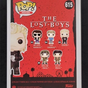 May include: Back of a Funko Pop! Movies box featuring characters from The Lost Boys. The box is red with white text and images of the characters. The characters include Michael Emerson, Sam Emerson, and David. The box also says "Collect them all!"