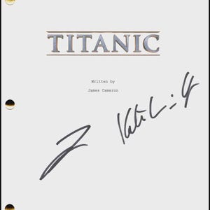 May include: A white script featuring the word "TITANIC" in silver lettering. The script is signed by James Cameron and another person. The script has three hole punches and a JSA authentication sticker.