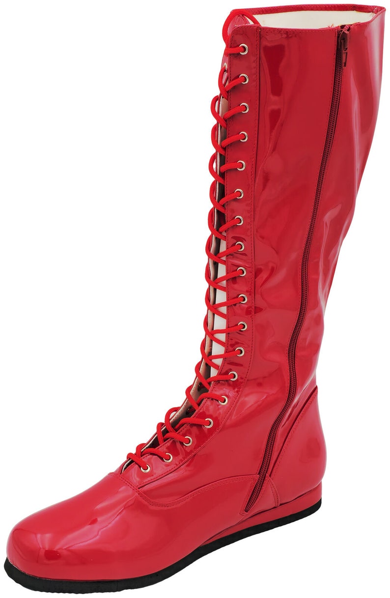 May include: Red leather wrestling boots with a lace-up front and a zipper on the side.
