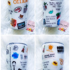 May include: White tumbler with a glitter finish featuring various images and text from the TV show "The Office".  The tumbler has a black lid and a black base.  The text on the tumbler includes "Dunder Mifflin Paper Company", "The Office", "That's What She Said", "Live Every Day Like It's Your Birthday", "World's Best Boss", "Fact", "Catch You On The Flippity Flip", "Michael Scott Paper Company Inc.", "Butlicker, Our Prices Have Never Been Lower", "You Miss 100% Of The Shots You Don't Take", "I'm Not Superstitious But I Am A Little Stitious", "Calm Down", "It's Never Too Late For Beer", "Save Bandit!" and "Chili's".