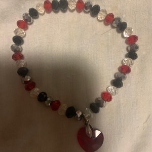 Stretch beaded bracelet with heart charm