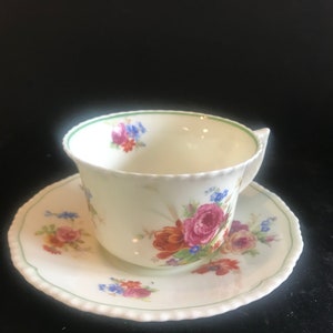 Royal Doulton “Scattered Flowers” Cup And Saucer. Circa 1920 To 1925. Scalloped Edges. Green Rim. Beautiful Colors.