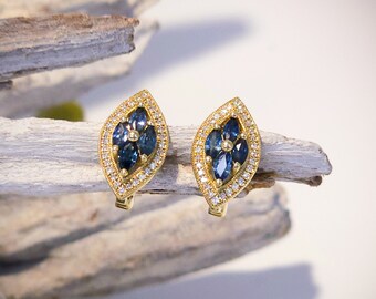 Aretes de zafiro azul y halo de diamantes