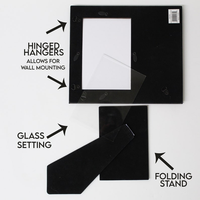 May include: Black picture frame with a glass setting, hinged hangers for wall mounting, and a folding stand.