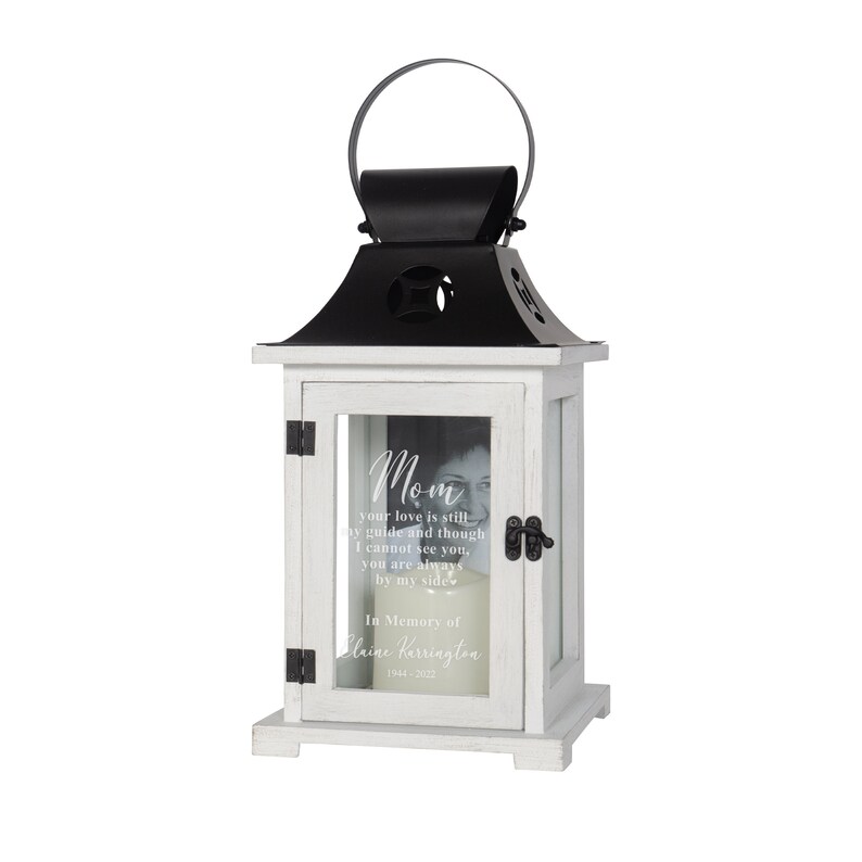 Personalized mom memorial lantern picture frame that reads Mom your love is still my guide and though I cannot see you you are always by my side and is personalized with name and date. Includes LED candle with automatic timer and handle on top.