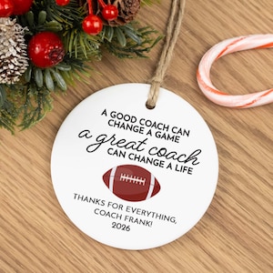 White ceramic Christmas ornament for a football coach as a thank you from a player and is personalized with a custom message, the coach's name, and the year