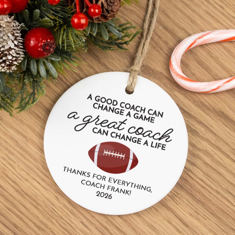White ceramic Christmas ornament for a football coach as a thank you from a player and is personalized with a custom message, the coach's name, and the year