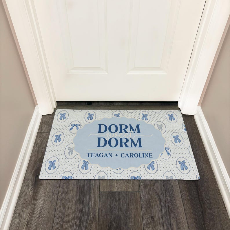 Dorm room welcome mat with blue coquette bows and personalized with names