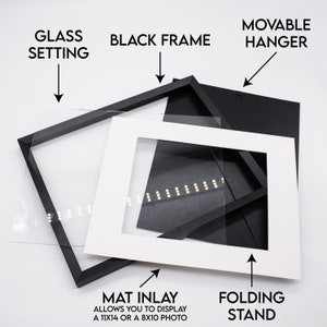 May include: A black picture frame with a white mat inlay, glass setting, and a movable hanger. The mat inlay allows you to display a 11x14 or 8x10 photo. The frame also includes a folding stand.