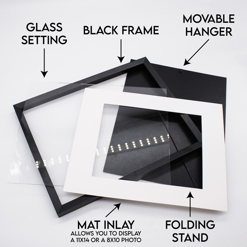 May include: A black picture frame with a white mat inlay, glass setting, and a movable hanger. The mat inlay allows you to display a 11x14 or 8x10 photo. The frame also includes a folding stand.