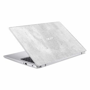 May include: A silver Acer laptop with a light grey, speckled concrete-like design on the lid. The laptop is slightly open, revealing the black keyboard and the Acer logo in the upper right corner.