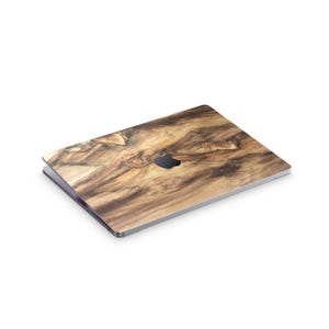 a laptop with a wooden-looking design on its surface.
