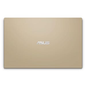 May include: A gold-colored laptop with the ASUS logo in the center. The laptop is rectangular with rounded corners. The surface has a smooth, matte finish. The laptop is closed.