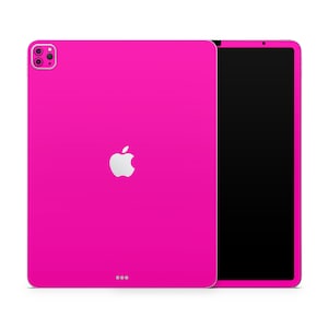 May include: A bright pink iPad case with a white Apple logo. The case is designed to fit the iPad Pro 12.9-inch model.