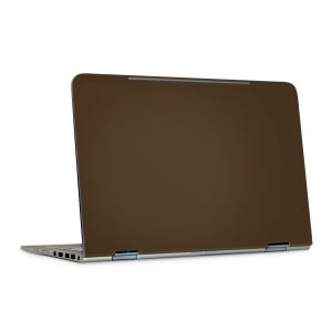 May include: A brown laptop computer with a silver frame is shown from a side angle. The screen is open, revealing the back of the display. The laptop is on a white background.