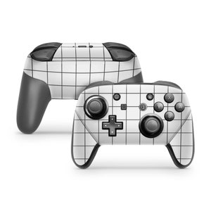 May include: A white Nintendo Switch controller with a black and white grid pattern. The controller has all the standard buttons, including A, B, X, Y, and a directional pad.