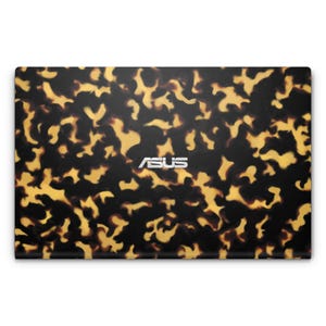 May include: A black laptop with a tortoiseshell pattern and the word "ASUS" in silver lettering on the lid.