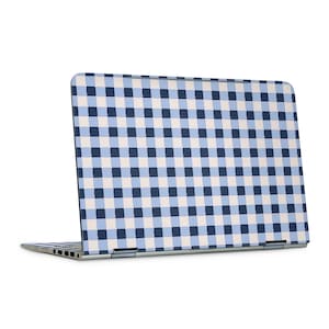 May include: A laptop with a blue, white, and navy blue gingham pattern on the lid. The laptop is open, revealing the keyboard and screen. The design is a classic, timeless pattern.