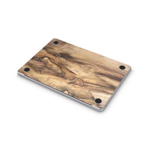 a laptop with a wooden-looking design on its surface.