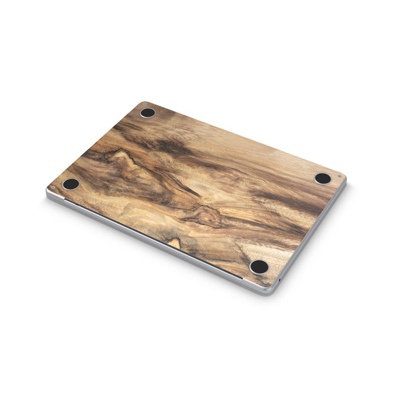 a laptop with a wooden-looking design on its surface.