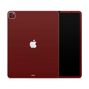 May include: A burgundy iPad case with a white Apple logo and a black screen.