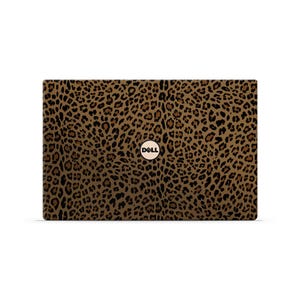 May include: A laptop with a leopard print design. The cover features a brown and black spotted pattern, with the Dell logo in the center. The laptop is rectangular and appears to be closed.