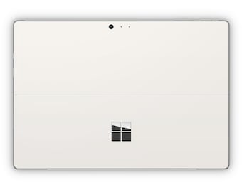May include: White tablet computer with a black Microsoft logo on the back.