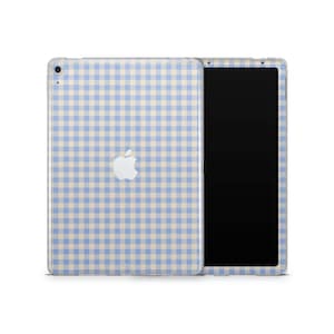 May include: A light blue and beige gingham patterned iPad case with the Apple logo. The iPad is shown with the screen on and off. The case is made of a clear material.