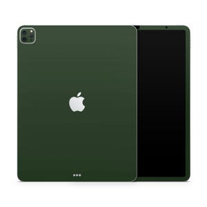 May include: A dark green iPad Pro with a white Apple logo on the back. The iPad is shown in landscape orientation with the screen off.