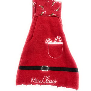 May include: Red and white Christmas stocking with a candy cane pattern and the text "Mrs. Claus" embroidered on the front.