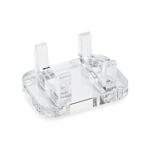 May include: A clear acrylic display stand with four vertical supports. The stand is designed to hold small items, such as jewelry or figurines.