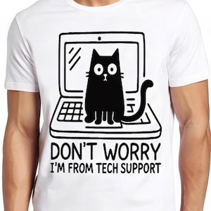 May include: White t-shirt featuring a black cartoon cat on a laptop, with the text "DON'T WORRY I'M FROM TECH SUPPORT". The cat has a surprised expression. The design is in black and white.