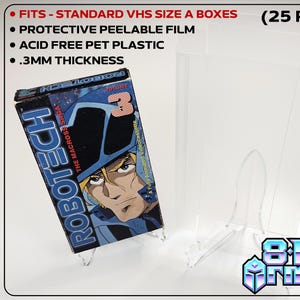 May include: Clear plastic VHS case protectors. Features include protective peelable film, acid-free PET plastic, and .3mm thickness. The image shows a VHS tape with the text "ROBOTECH" and "THE MACROSS SAGA". The text "8 Bit Armor" is also visible.