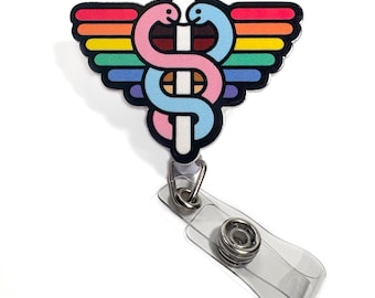 May include: A rainbow-colored medical caduceus with a pink and blue snake, attached to a clear plastic retractable badge holder.