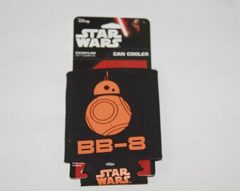 May include: Black and orange Star Wars can cooler featuring BB-8. The cooler has the words "Star Wars" and "Can Cooler" on the packaging.