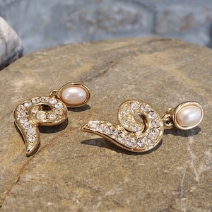 Vintage Designer Jewellery : Monet gold tone and diamante pierced earrings 3.5cm, signed.