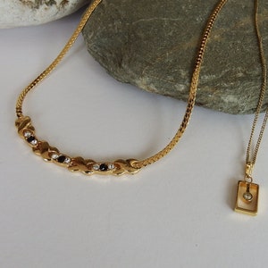 Vintage gold rectangle with diamante stone length 46cm, gold coloured with black/diamante stones 44cm length