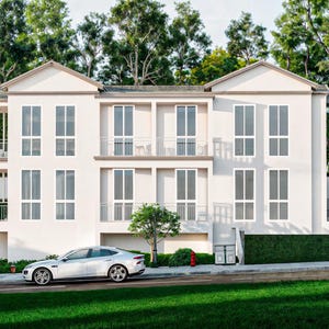 Puede incluir: Un edificio blanco moderno de dos pisos con múltiples ventanas y balcones. Un coche plateado está estacionado en la calle frente al edificio. La exuberante hierba verde y los árboles rodean el edificio, creando un ambiente sereno.