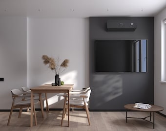 May include: A modern dining room with a wooden table and four white chairs. A vase with dried flowers sits on the table, and a green apple is on a plate. The room has a white wall and a dark gray wall with a black television mounted on it. A small round table with a magazine on it is in the corner of the room.