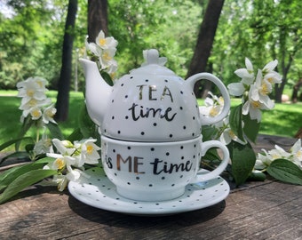 Tetera de porcelana con lunares, taza y platillo, juego de té