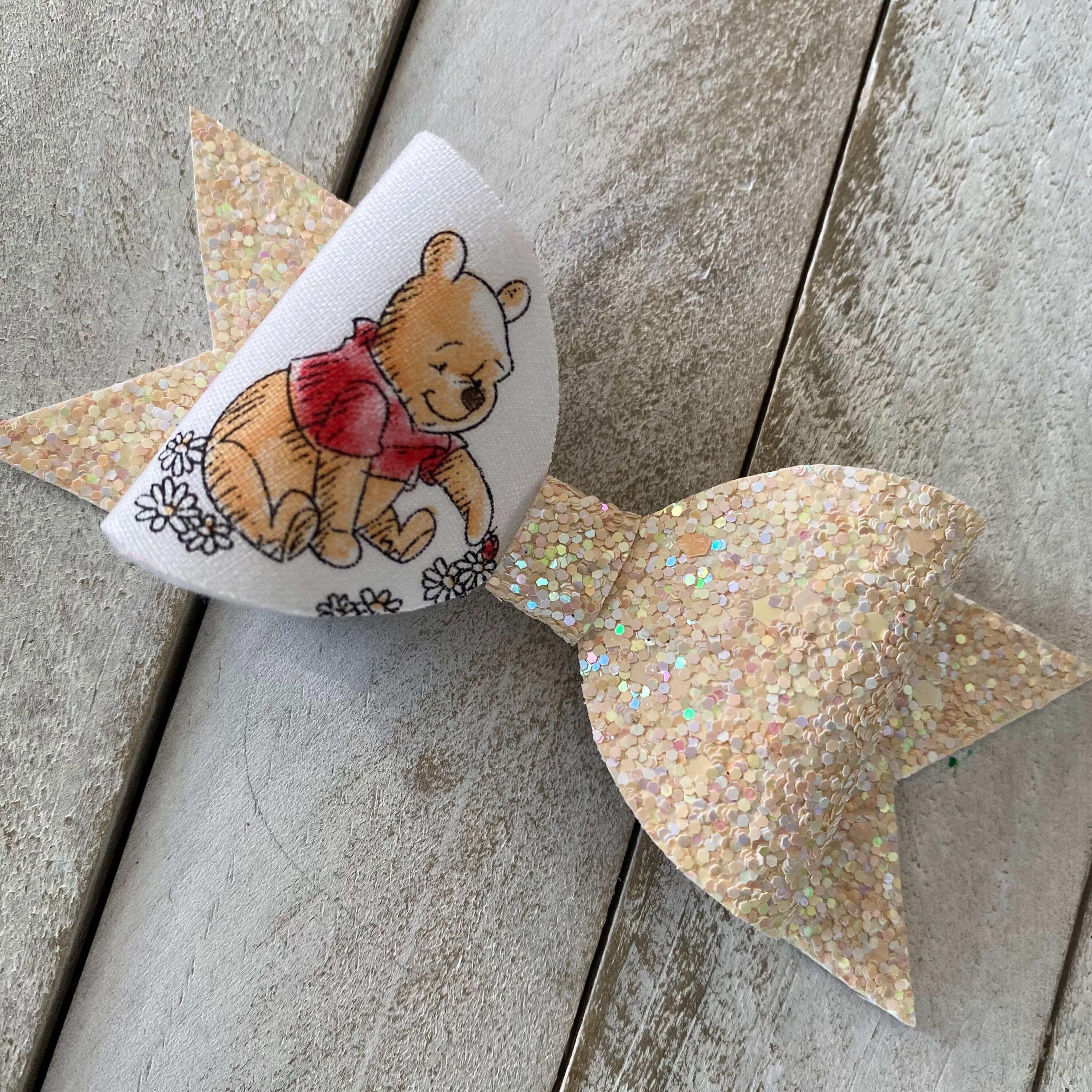 Ribbon Chick - #theribbonchicks 4” Winnie the Pooh Faux Leather Bow 6  available. #fauxleatherbows #hairbows #bows #winniethepooh  #winniethepoohbow #poohhairbow