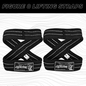 May include: A pair of black figure 8 lifting straps with white stitching. The straps have the text "Champions of the world... ESTREMO" and "WWW.ESTREMO.US" printed on them.