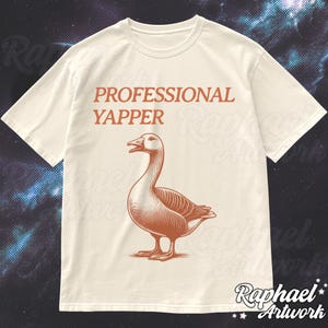 May include: A white t-shirt with the text "PROFESSIONAL YAPPER" printed in orange. A brown goose illustration is below the text.