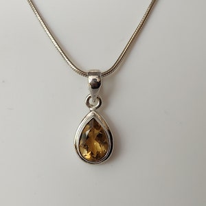 Genuine Ameterine pendant in sterling silver with free sterling silver chain (16&quot;to 18&quot;) teardrop and rectangle shape.
