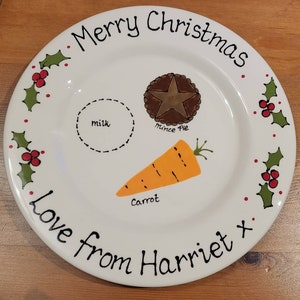 May include: White ceramic plate with a hand-painted design of a carrot, mince pie, milk, and holly. The plate has the text "Merry Christmas Love from Harriet x" written on it.