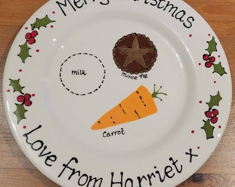 May include: White ceramic plate with a hand-painted design of a carrot, mince pie, milk, and holly. The plate has the text "Merry Christmas Love from Harriet x" written on it.