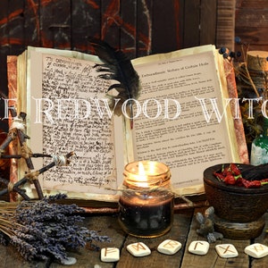May include: An open book with handwritten text, a black feather, and lit candles are featured in this image. Other items include a mortar and pestle, a glass bottle, and the text "THE REDWOOD WITCH".