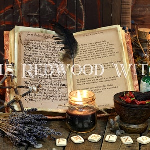 May include: A still life arrangement featuring a spell book, candles, and various mystical items. The text "THE REDWOOD WITCH" is displayed across the image. Other items include a mortar and pestle, herbs, and bottles.