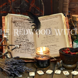 May include: An open book with handwritten text, a black feather, and lit candles. The image features a collection of mystical items, including a mortar and pestle, herbs, and rune stones, with the text "THE REDWOOD WITCH".
