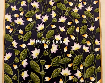 May include: A detailed painting of white lotus flowers with yellow centers and green leaves against a dark blue background. The artwork features the text "Pichwaifactory" and is framed with a gold border, showcasing a floral theme.